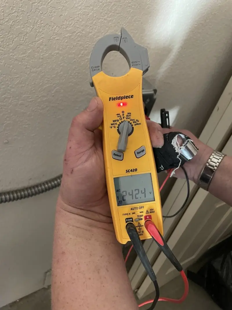 Voltage testing with clamp meter during Ceiling Fan Installation in Southborough